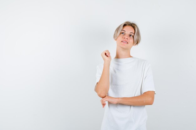 Expressive young boy posing in the studio