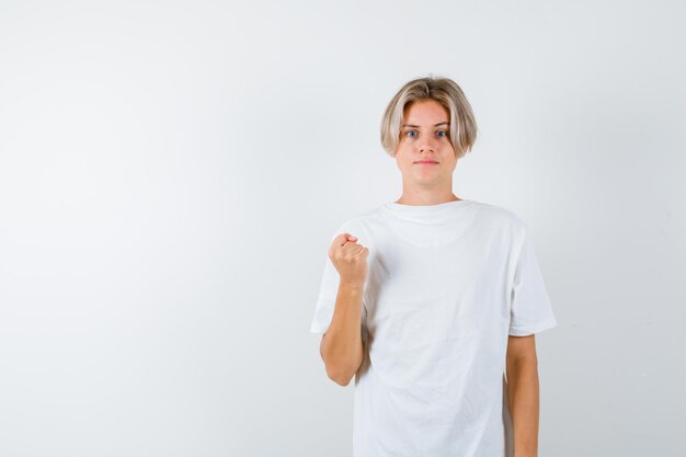 Expressive young boy posing in the studio