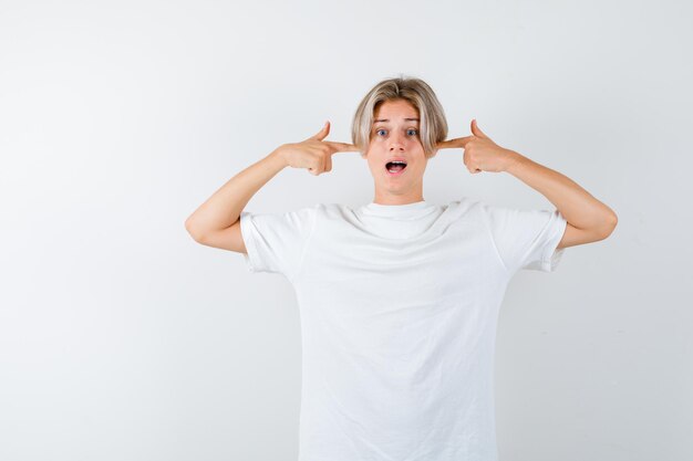 Expressive young boy posing in the studio