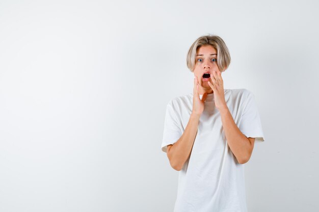 Expressive young boy posing in the studio