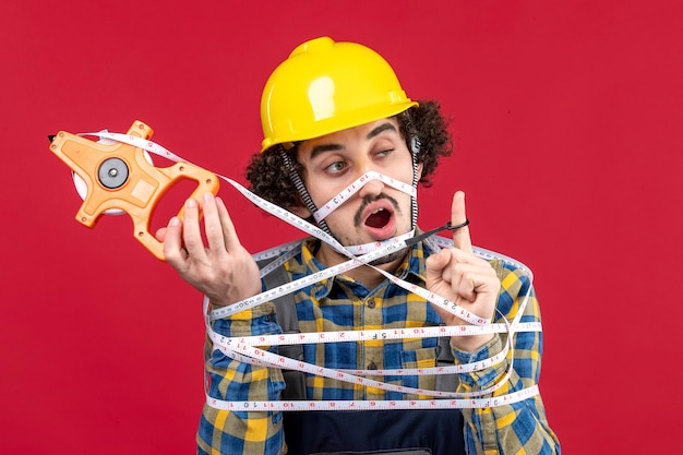 Expressive young builder posing for winter holidays