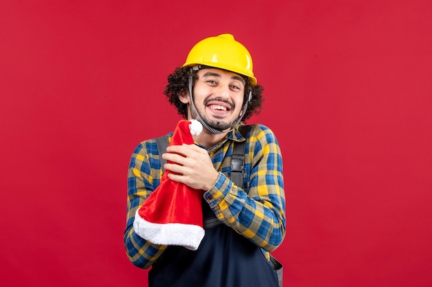 Expressive young builder posing for winter holidays