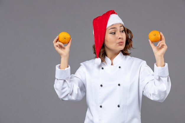 Free photo expressive young cook posing for winter holidays