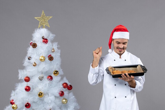 Expressive young cook posing for winter holidays