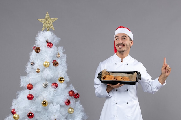 Free photo expressive young cook posing for winter holidays