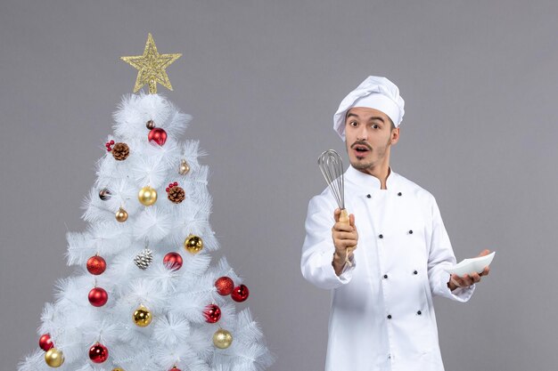 Expressive young cook posing for winter holidays