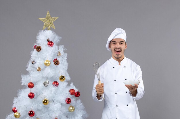 Expressive young cook posing for winter holidays