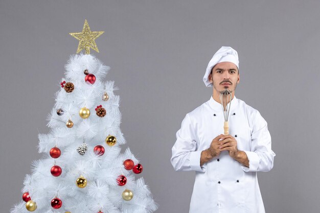 Expressive young cook posing for winter holidays