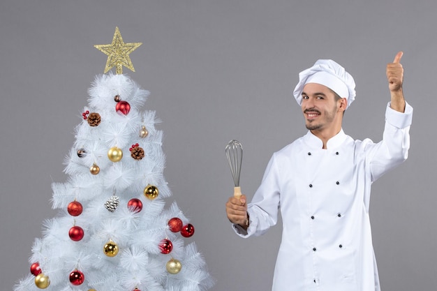 Expressive young cook posing for winter holidays