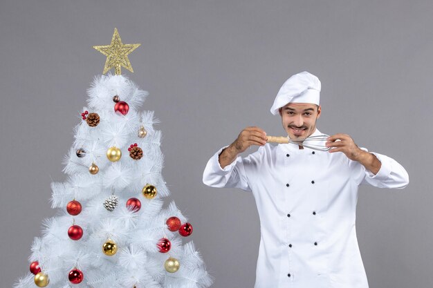 Expressive young cook posing for winter holidays