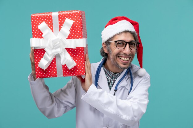 Expressive young doctor posing for winter holidays