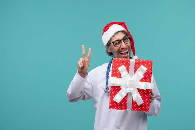 Expressive young doctor posing for winter holidays