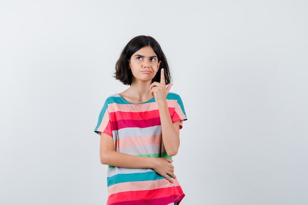 Expressive young girl posing in the studio