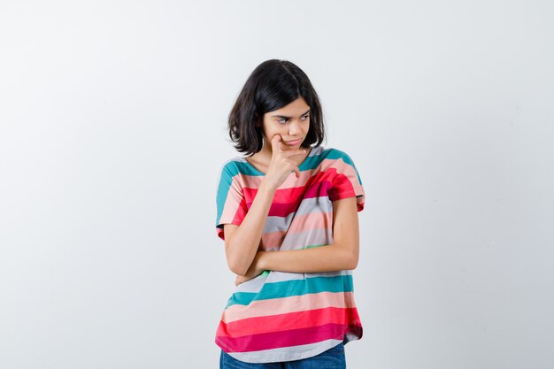 Expressive young girl posing in the studio