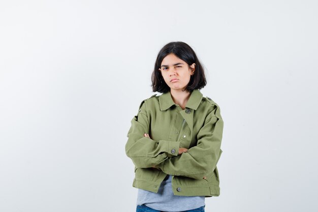 Expressive young girl posing in the studio