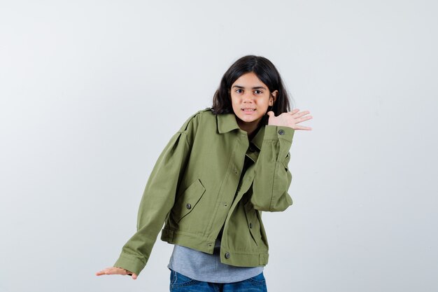 Expressive young girl posing in the studio