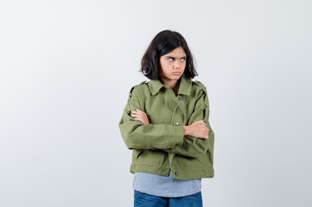 Expressive young girl posing in the studio