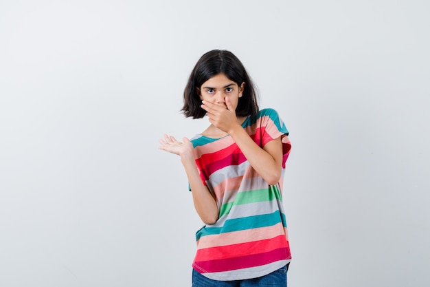 Expressive young girl posing in the studio