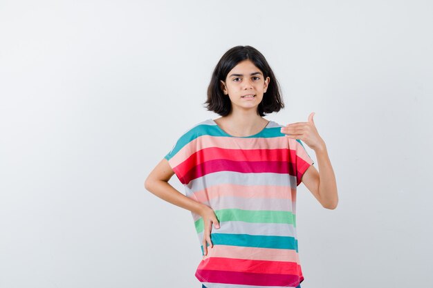 Expressive young girl posing in the studio