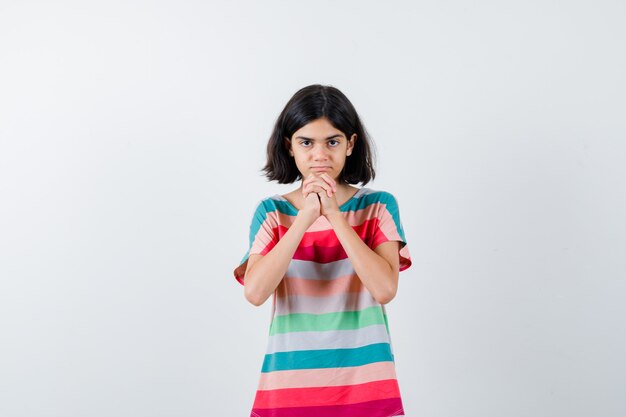 Expressive young girl posing in the studio