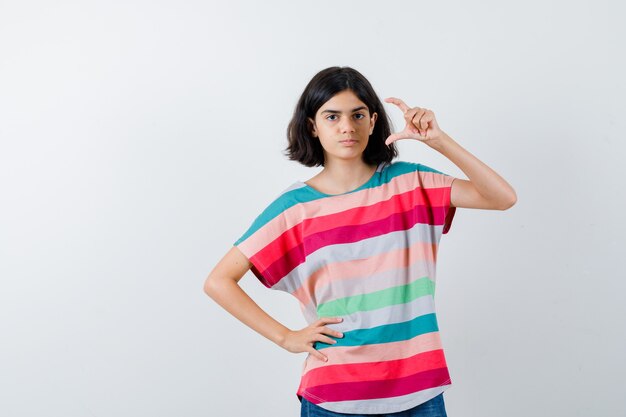 Expressive young girl posing in the studio