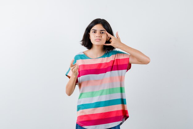 Expressive young girl posing in the studio