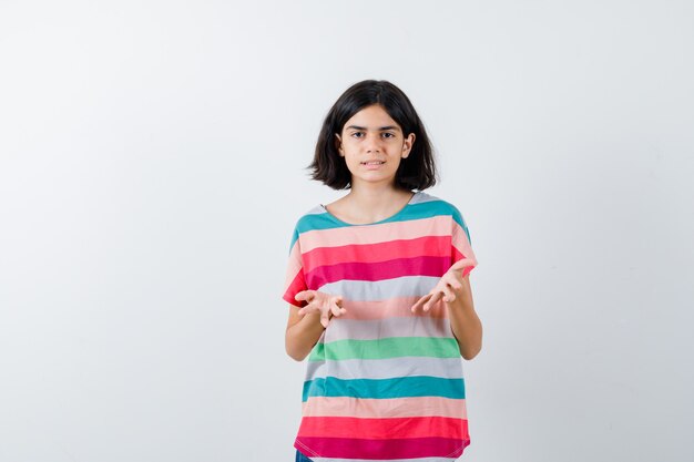 Expressive young girl posing in the studio