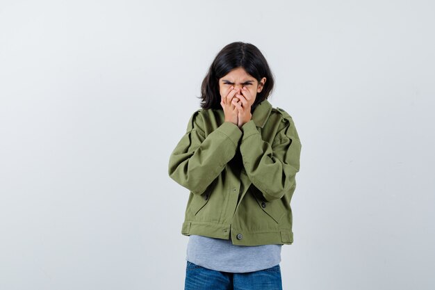 Expressive young girl posing in the studio