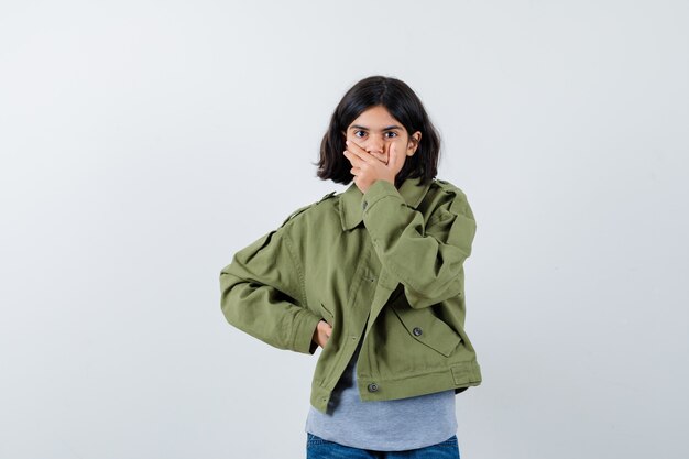 Expressive young girl posing in the studio