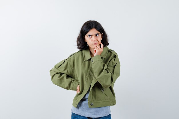 Expressive young girl posing in the studio