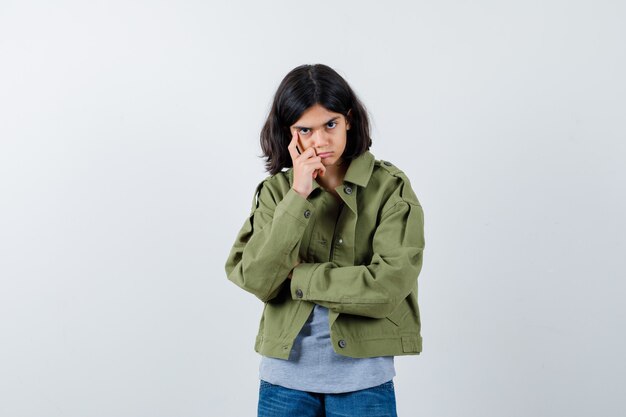 Expressive young girl posing in the studio