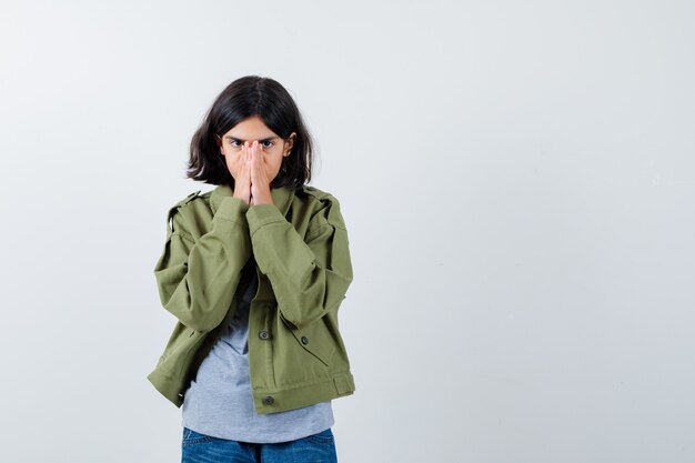 Expressive young girl posing in the studio