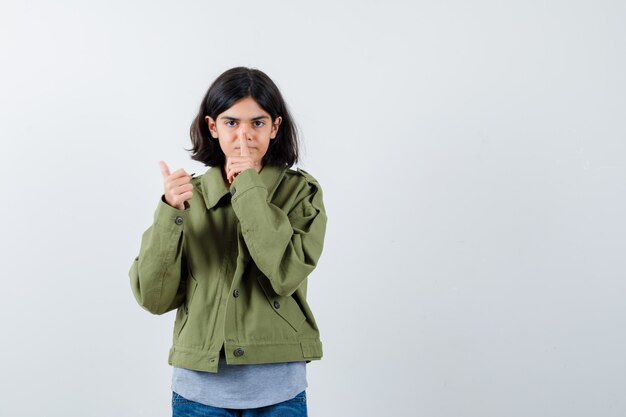 Expressive young girl posing in the studio