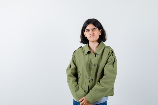 Expressive young girl posing in the studio