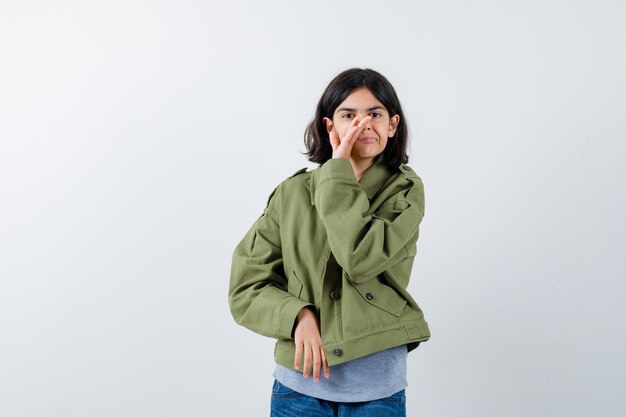 Expressive young girl posing in the studio