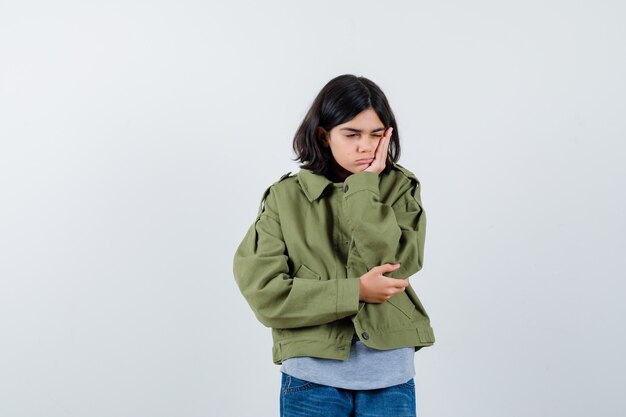 Expressive young girl posing in the studio