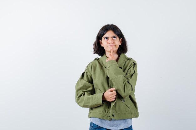 Expressive young girl posing in the studio