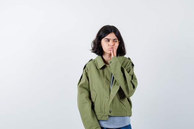 Expressive young girl posing in the studio