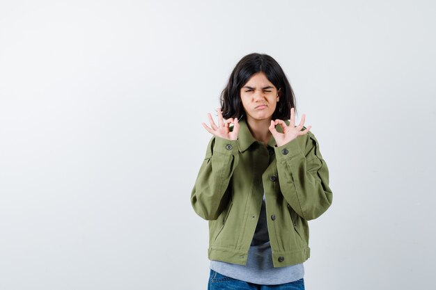 Expressive young girl posing in the studio