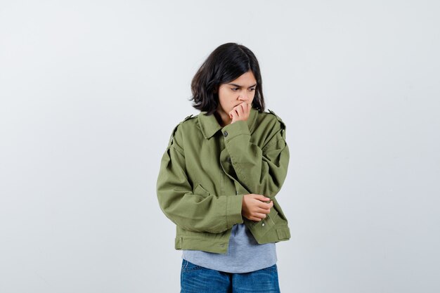 Expressive young girl posing in the studio