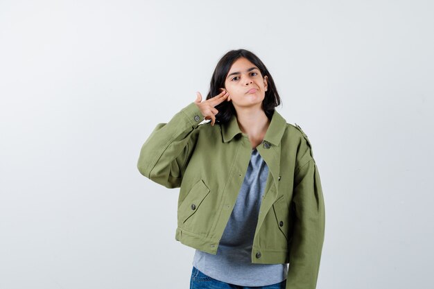 Expressive young girl posing in the studio