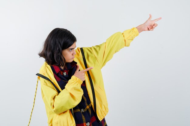 Expressive young girl posing in the studio