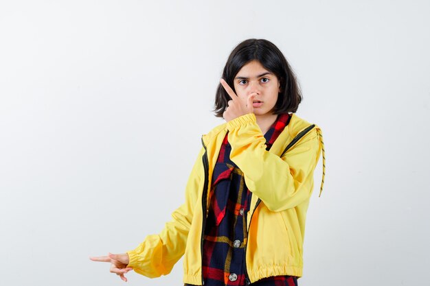 Expressive young girl posing in the studio