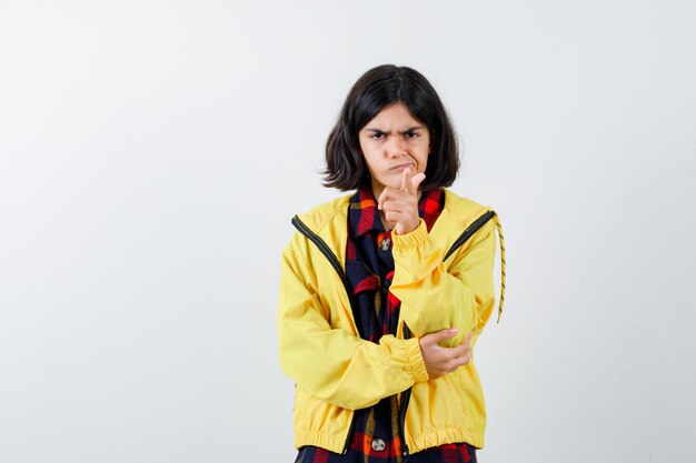 Expressive young girl posing in the studio