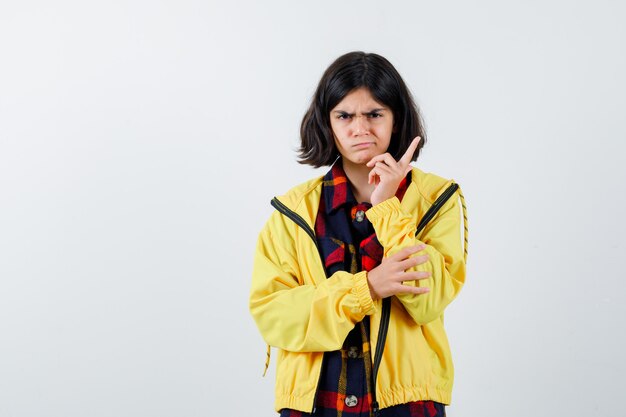 Expressive young girl posing in the studio