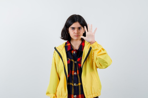 Expressive young girl posing in the studio