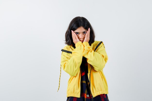 Expressive young girl posing in the studio