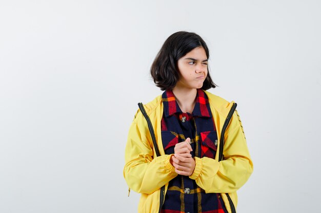 Expressive young girl posing in the studio