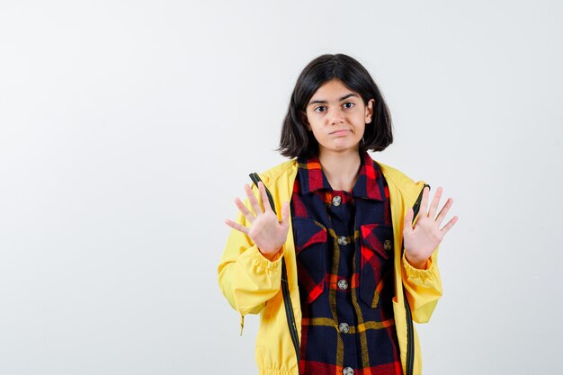 Expressive young girl posing in the studio