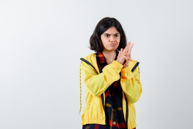 Expressive young girl posing in the studio